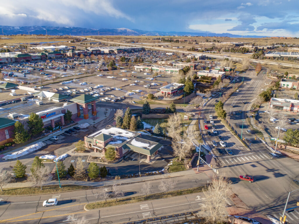 Aerial image of a business complex and parking lot