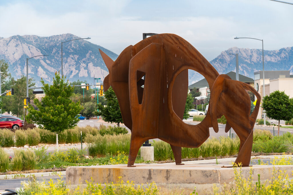 Image of abstract metal art structure of a rust colored buffalo