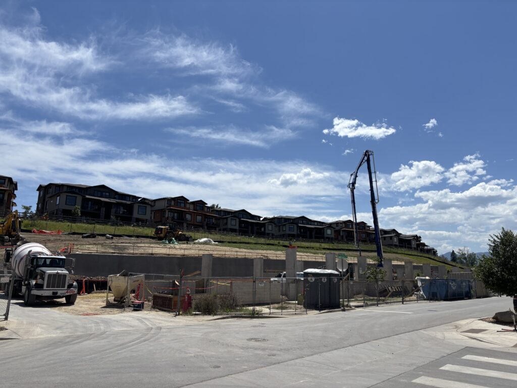 The Kite Route Crossing site under development with concrete poured areas and construction equipment.
